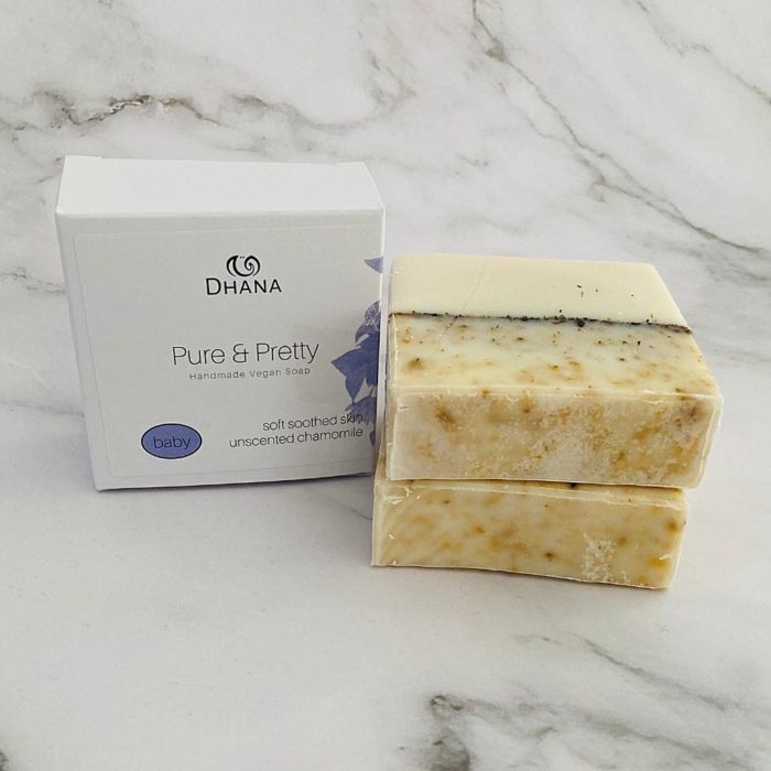 pure & pretty Dhana Soap bar RTSB01 has yellow variation on the top a black line across the middle and white on the bottom. P&P boxes are white and blue. The soap is unscented with ground chamomile flowers.