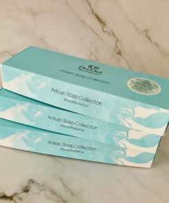 turquoise gift boxes from dhana selfcare on marble backdrop