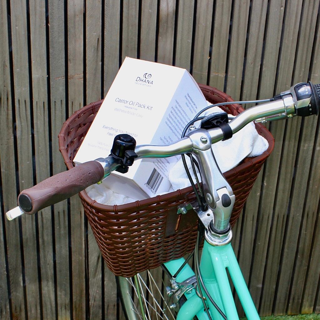 castor oil pack box in a bike basket