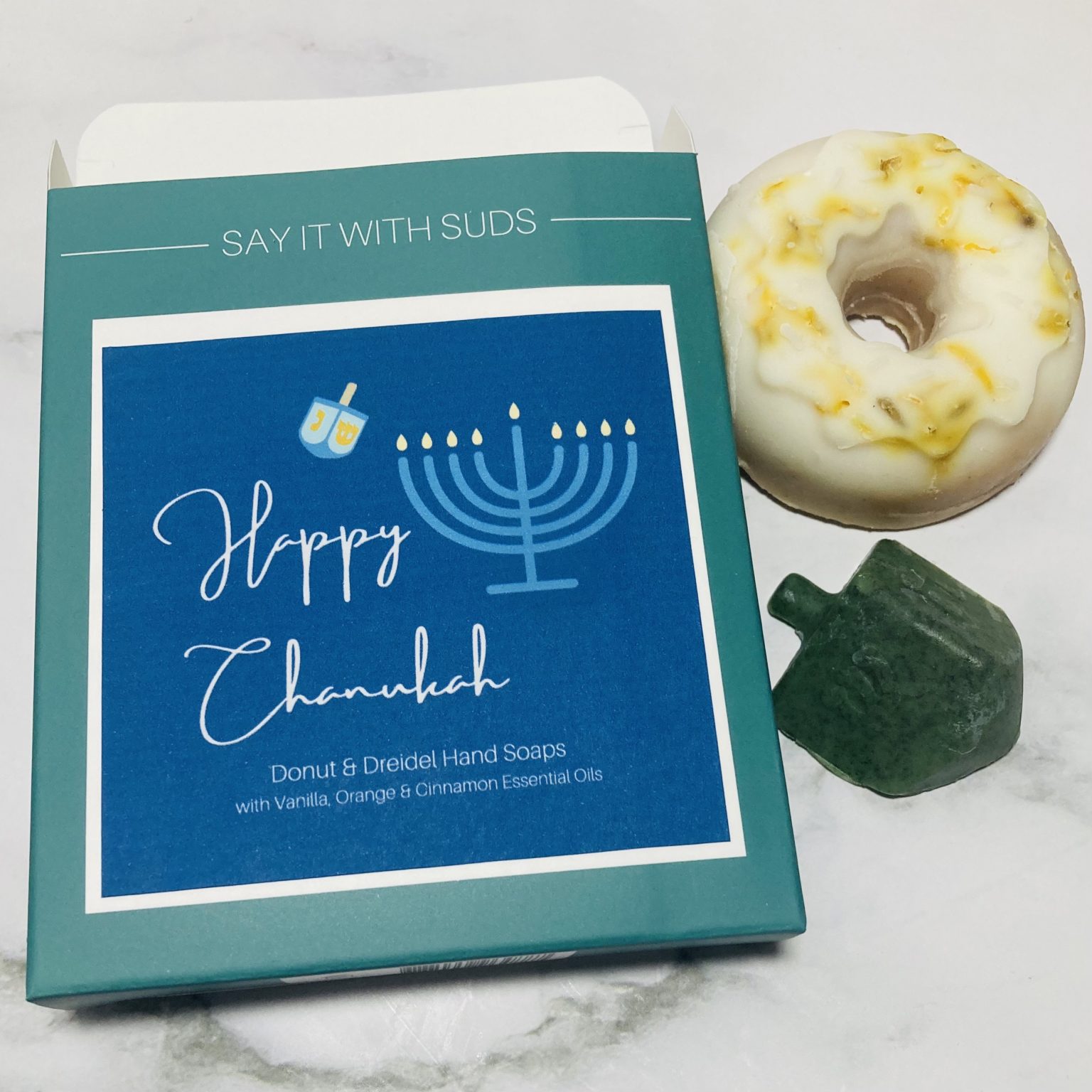 Happy Chanukah Box with donut and dreidel soap beside it