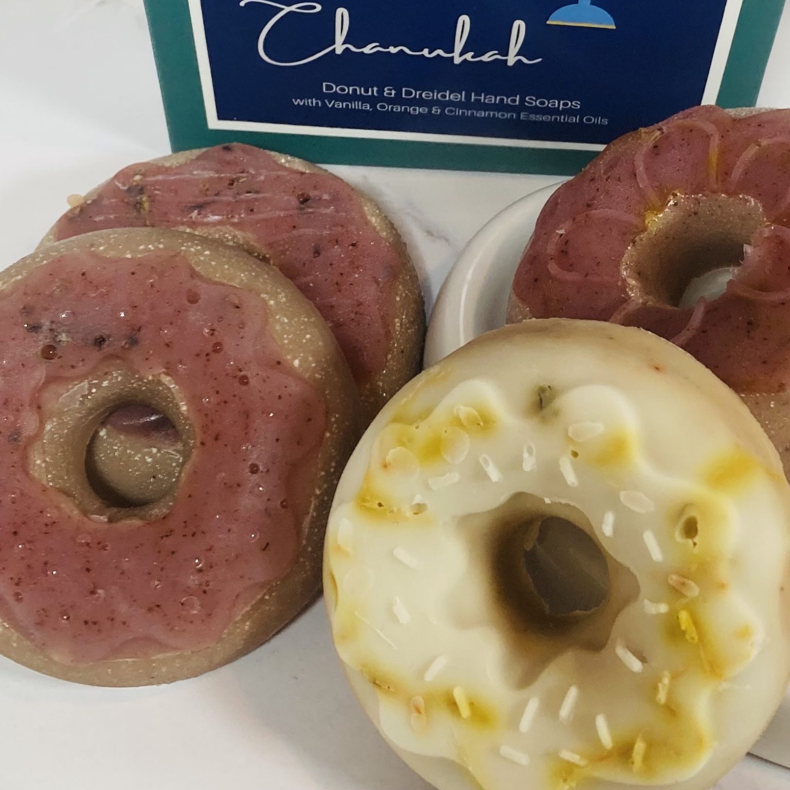 brown and red, and tan and yellow donut soaps - they are the type with the whole in the middle.