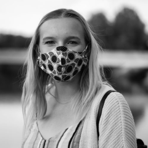 black and white picture of a girl in a mask for a feedback picture.