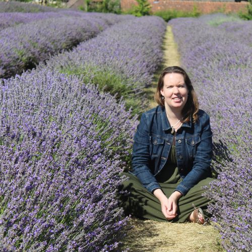 Dhana Founder, Ashley, in lavender field.