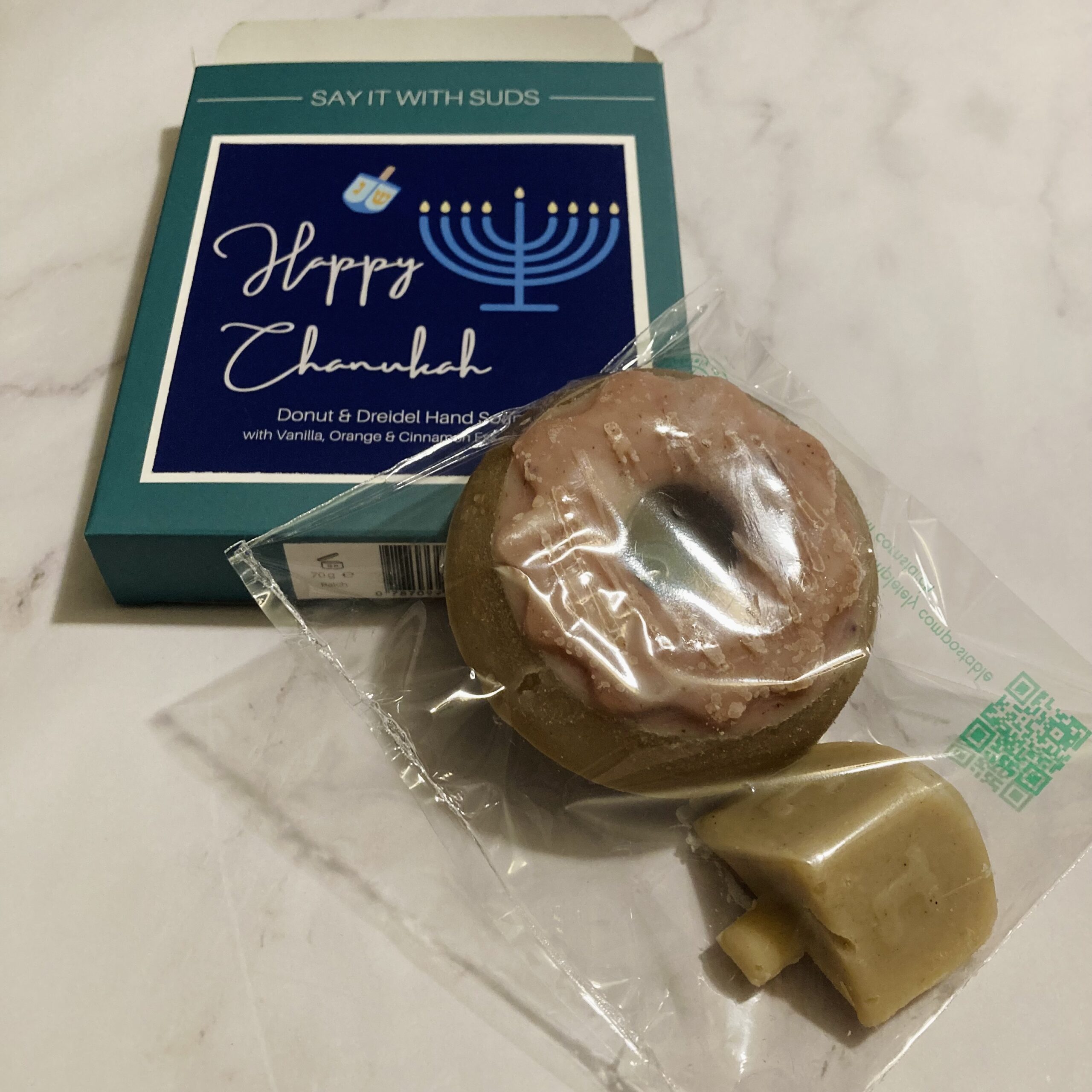 packaging for donut and dreidel plus happy hanukkah gift box.