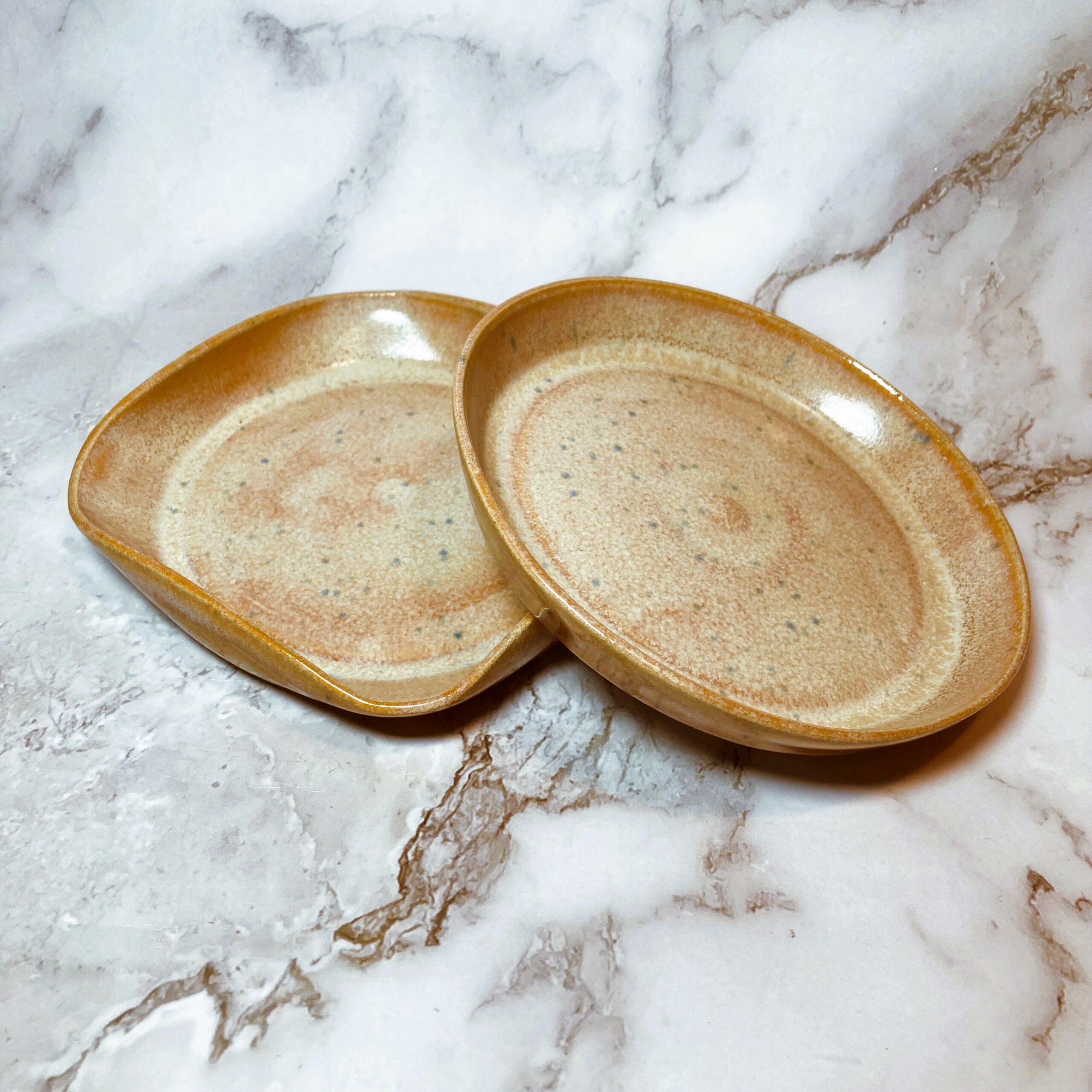 brown soap dishes on marble